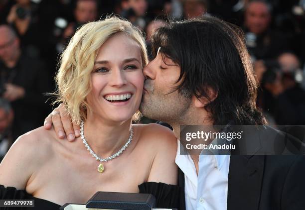 German actress Diane Kruger poses with her director Fatih Akin during the Award Winners photocall after she won the Best Actress Prize for Aus dem...