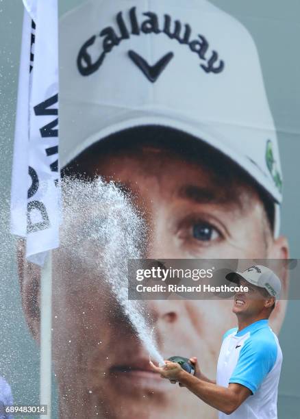 Alex Noren of Sweden sprays champagne after winning the BMW PGA Championship at Wentworth on May 28, 2017 in Virginia Water, England.