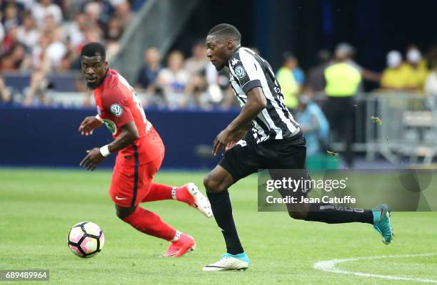 Karl Toko Ekambi of Angers and Serge Aurier of PSG during the French Cup final between Paris Saint-Germain and SCO Angers at Stade de France on May...