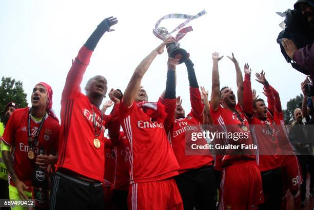 Benfica's players celebrate with trophy after winning the Portuguese Cup Title at the end of the Portuguese Cup Final match between SL Benfica and...