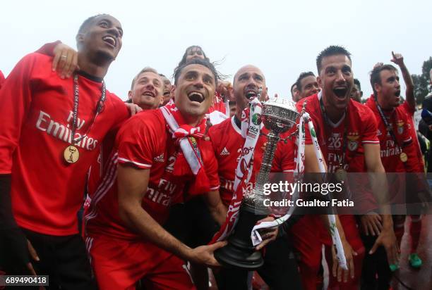 Benfica's players celebrate with trophy after winning the Portuguese Cup Title at the end of the Portuguese Cup Final match between SL Benfica and...