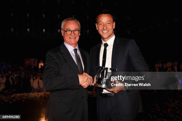 Claudio Ranieri presents John Terry of Chelsea poses with a Special Recognition award given to him by Chelsea during the Chelsea Player of the Year...