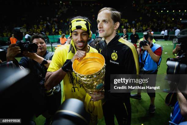 Pierre-Emerick Aubameyang and Thomas Tuchel of Dortmund celebrate with the trophy after winning the DFB Cup Final 2017 between Eintracht Frankfurt...