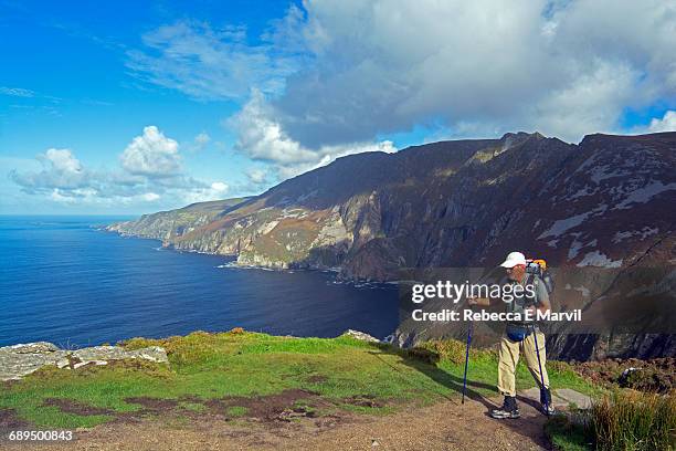 hiker on slieve league, donegal, ireland - slieve league donegal stock pictures, royalty-free photos & images