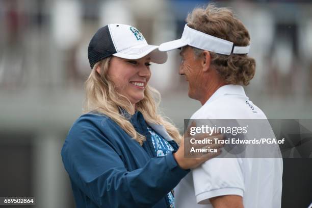 Bernhard Langer's daughter Christina Langer congratulates him on his win on the 18th green during Final Round for the 78th KitchenAid Senior PGA...