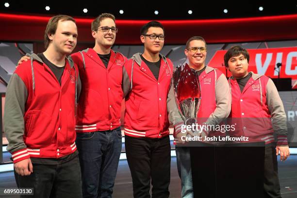 Marko Sosnicki, Andrew Smith, Tony Chau, Cody Altman, and John Le pose with the championship trophy after defeating the University of Toronto in the...