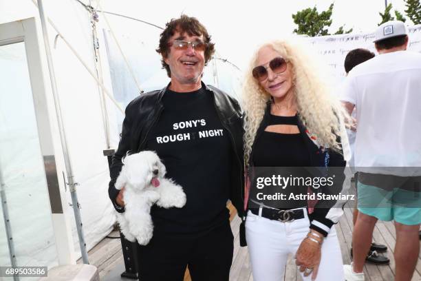 Richard Rubens, Barbara Rubens and their dog Baci attend DuJour Media's Annual Memorial Day Kick-Off Party at Gurney's Montauk Resort and Seawater...