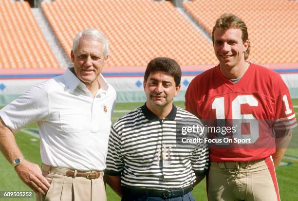 Quarterback Joe Montana, owner Eddie DeBartolo Jr., and head coach Bill Walsh of the San Francisco 49ers poses together for this photo before Super...