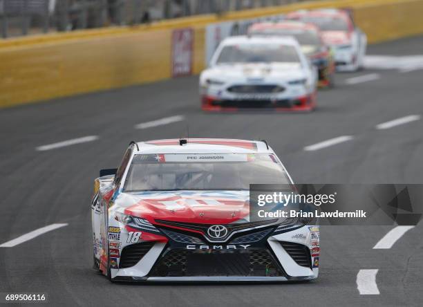 Kyle Busch, driver of the M&M's Red, White, & Blue Toyota, leads Kevin Harvick, driver of the Mobil 1 Ford, during the Monster Energy NASCAR Cup...