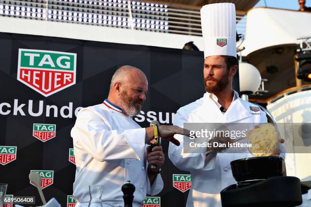 Chef Philippe Etchebest and Actor Chris Hemsworth at the TAG Heuer Culinary Challenge on May 27, 2017 in Monte-Carlo, Monaco.