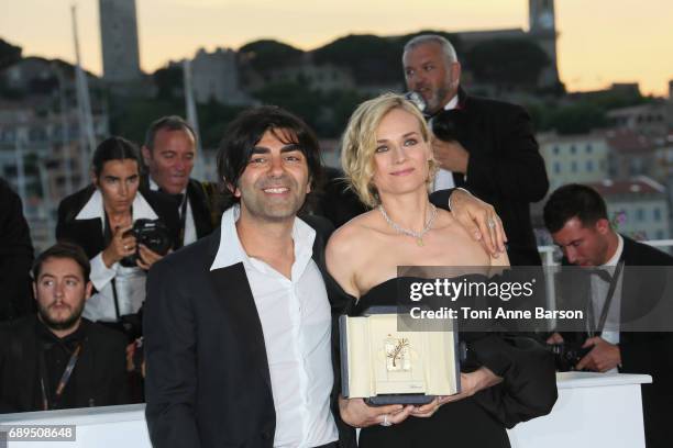 Diane Kruger winner of the award for best actress for her part in the movie 'In The Fade' and director Fatih Akin attend the winners photocall during...