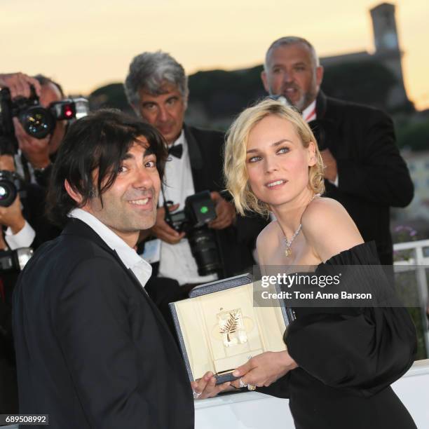 Diane Kruger winner of the award for best actress for her part in the movie 'In The Fade' and director Fatih Akin attend the winners photocall during...