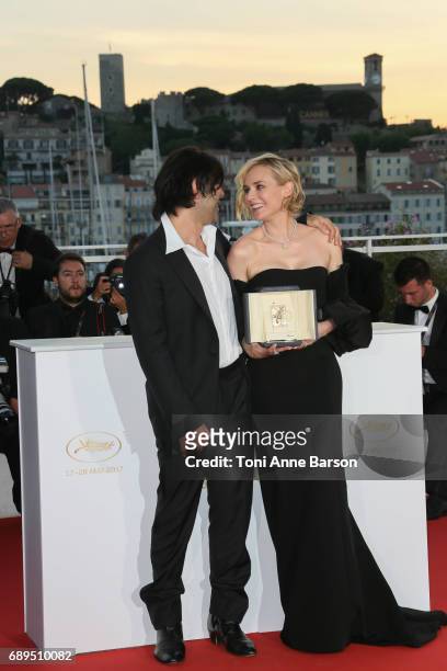 Diane Kruger winner of the award for best actress for her part in the movie 'In The Fade' and director Fatih Akin attend the winners photocall during...