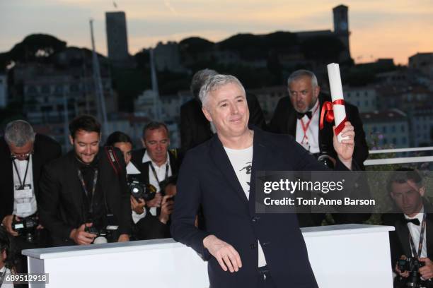 Robin Campillo winner of the Grand Prix for the movie '120 Beats Per Minute' attends the winners photocall during the 70th annual Cannes Film...