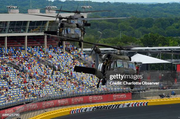 Blackhawk helicopters fly over the infield of Charlotte Motor Speedway on Sunday, May 28, 2017 prior to the running of the Coca-Cola 600 race.