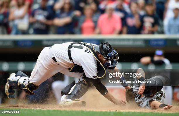 Evan Longoria of the Tampa Bay Rays slides safely past Jason Castro of the Minnesota Twins to score a run during the ninth inning of the game on May...