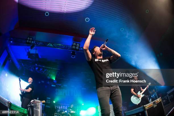 Jeff Stinco, Pierre Bouvier and Sebastien Lefebvre of the Canadian band Simple Plan perform live on stage during a concert at the Astra on May 28,...