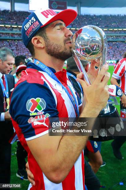 Jair Pereira of Chivas kisses the champions trophy after the Final second leg match between Chivas and Tigres UANL as part of the Torneo Clausura...