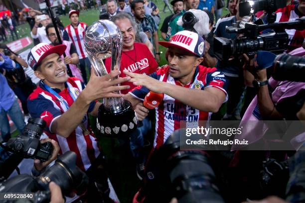 Jesus Sanchez and Edwin Hernandez of Chivas celebrate with the champions trophy after winnig the Final second leg match between Chivas and Tigres...