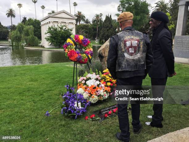 Musician Tom Morello and Producer Nile Rogers view Chris Cornell's tombstone at Hollywood Forever on May 26, 2017 in Hollywood, California. The...