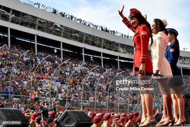 Members of the USO wave to the crowd prior to the start of the Monster Energy NASCAR Cup Series Coca-Cola 600 at Charlotte Motor Speedway on May 28,...