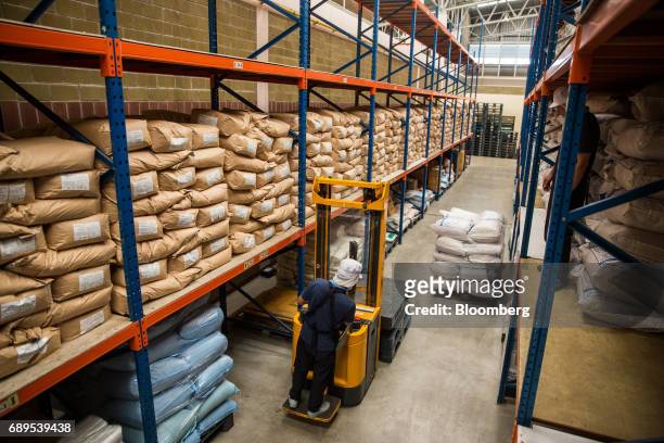 Worker operates a forklift inside a warehouse at the Nithi Foods Co. Factory in the San Pa Tong district of Chiang Mai, Thailand, on Tuesday, May 23,...