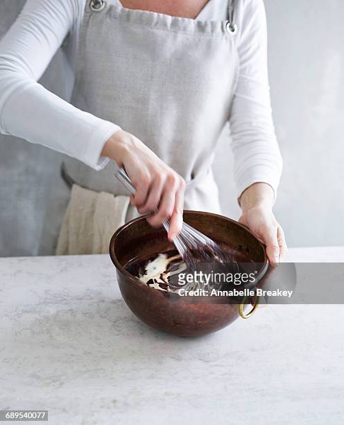 woman stirring cream into chocolate - female whipping 個照片及圖片檔