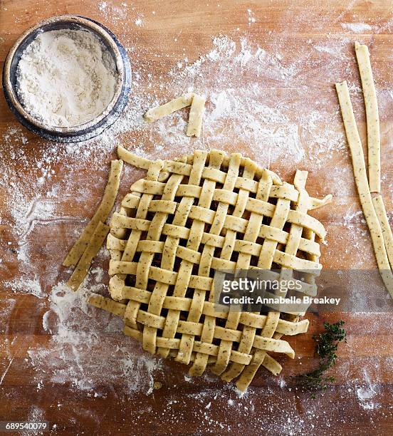 preparation of savory meat pie with lattice crust - savory pie stockfoto's en -beelden