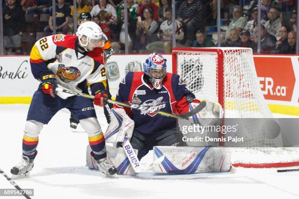 Forward Anthony Cirelli of the Erie Otters deflects the puck against goaltender Michael DiPietro of the Windsor Spitfires on May 28, 2017 during the...