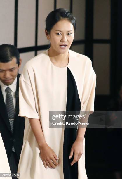 Former women's world No. 1 golfer Ai Miyazato arrives at the venue for a press conference in Tokyo on May 29 to formally announce her decision to...