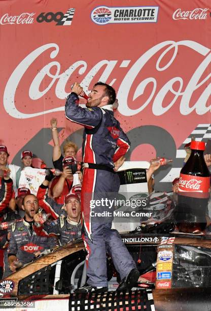 Austin Dillon, driver of the DOW Salutes Veterans Chevrolet, celebrates after winning the Monster Energy NASCAR Cup Series Coca-Cola 600 at Charlotte...