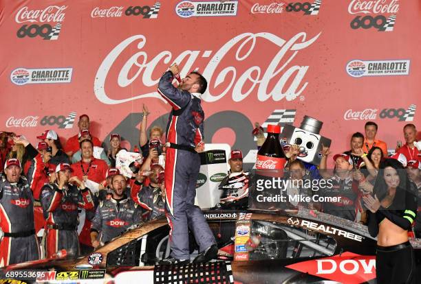 Austin Dillon, driver of the DOW Salutes Veterans Chevrolet, celebrates after winning the Monster Energy NASCAR Cup Series Coca-Cola 600 at Charlotte...