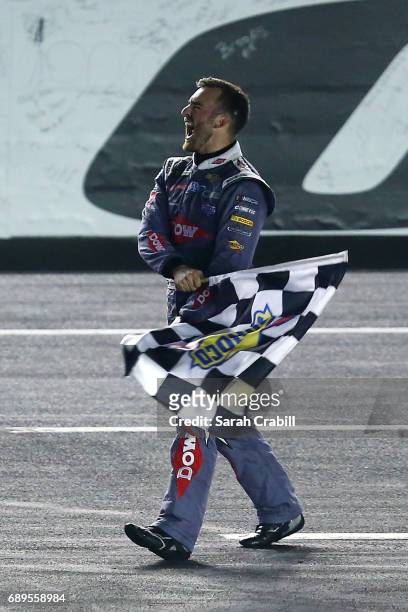Austin Dillon, driver of the DOW Salutes Veterans Chevrolet, celebrates with the checkered flag after winning the Monster Energy NASCAR Cup Series...