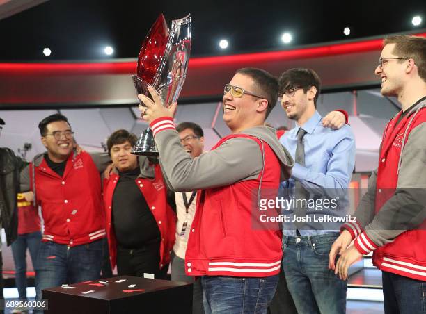 Player of the series, Cody Altman holds the championship trophy at the League of Legends College Championship between Maryville University and the...