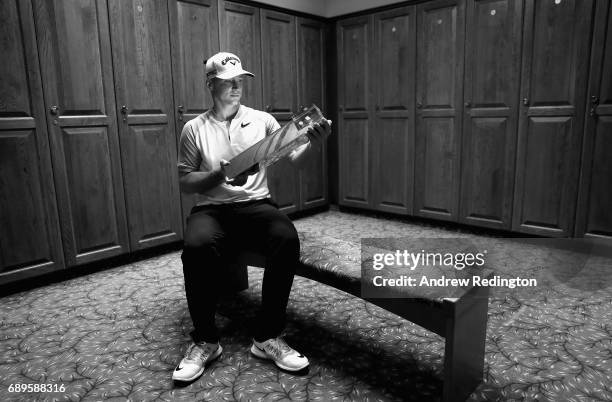 Alex Noren of Sweden poses with the trophy after winning the BMW PGA Championship at Wentworth on May 28, 2017 in Virginia Water, England.