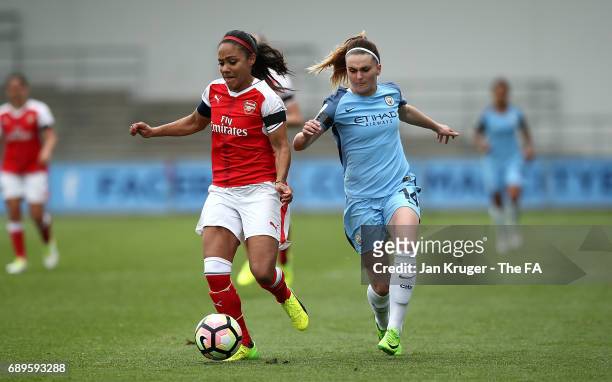 Alex Scott of Arsenal Ladies controls the ball from Melissa Lawley of Manchester City Women during the WSL 1 match between Manchester City Ladies and...
