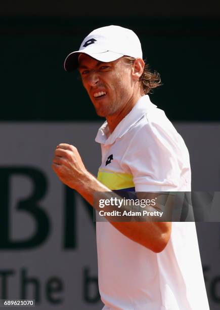 John Millman of Australia celebrates during the mens singles first round match against Roberto Bautista Agut of Spain on day two of the 2017 French...