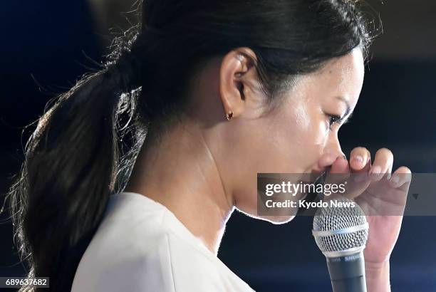 Former women's world No. 1 golfer Ai Miyazato is moved to tears while announcing her decision to retire during a press conference in Tokyo on May 29,...