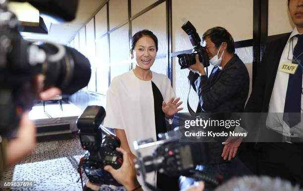 Former women's world No. 1 golfer Ai Miyazato completes a press conference in Tokyo on May 29 during which she formally announced her decision to...