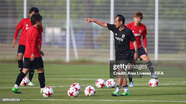 Atsushi Uchiyama the coach of Japan gives instructions during a training session at the Daejeon World Cup Stadium training pitch during the FIFA U-20...