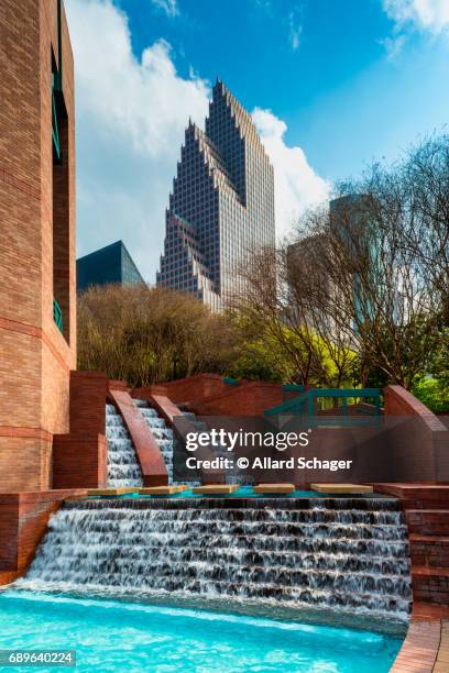man made waterfall in park in downtown houston texas - downtown houston stock pictures, royalty-free photos & images