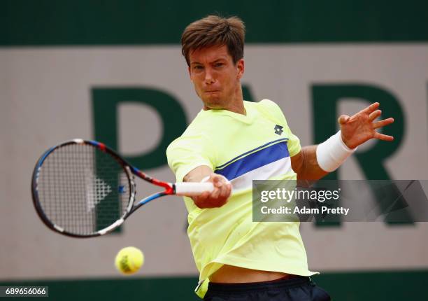 Aljaz Bedene of Great Britain plays a forehand during the mens singles first round match against Ryan Harrison of The United States on day two of the...