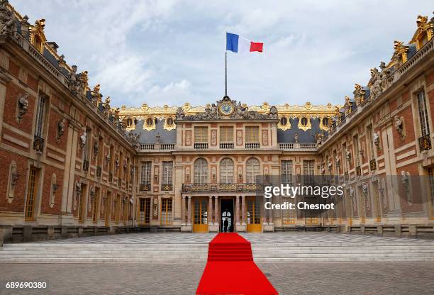 Red carpet has been set in the courtyard of the Versailles Palace ahead of the arrival of Russian President Vladimir Putin for a meeting with French...