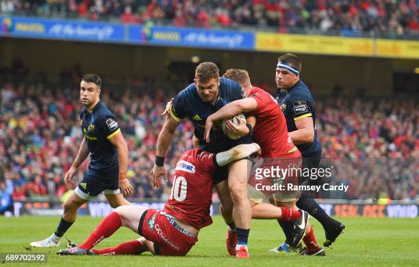 Dublin , Ireland - 27 May 2017; Jaco Taute of Munster is tackled by Rhys Patchell, left, and James Davies of Scarlets during the Guinness PRO12 Final...