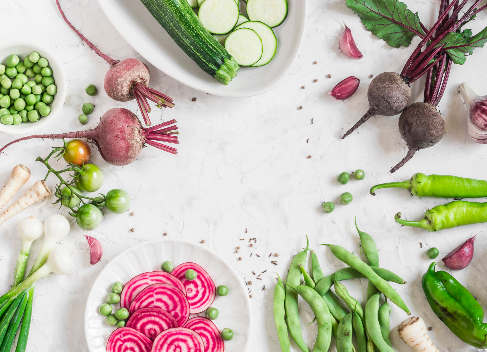 Organic purple and green vegetables on a white background. Detox ingredients. Healthy, vegetarian food concept. Top view, free space for text. Flat lay Organic purple and green vegetables on a white background. Detox ingredients. Healthy, vegetarian food concept. Top view, free space for text. Flat lay