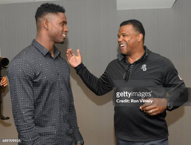 Cuban outfielder Luis Robert visits with Chicago White Sox Executive Vice-President Ken Williams prior to the game against the Detroit Tigers on May...