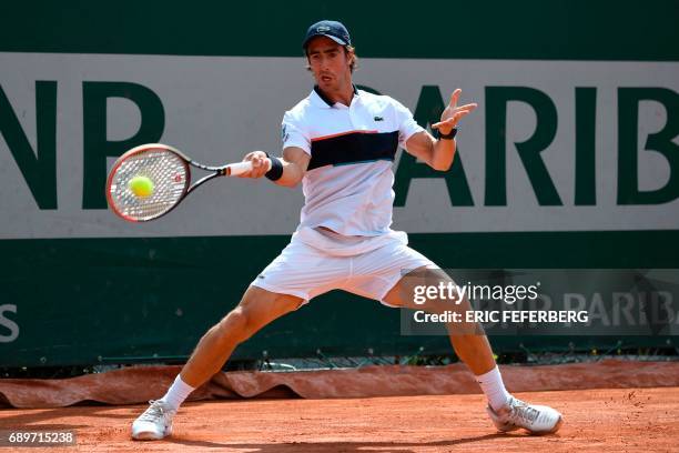 Uruguay's Pablo Cuevas returns the ball to France's Maxime Hamou during their tennis match at the Roland Garros 2017 French Open on May 29, 2017 in...