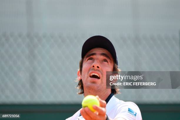 Uruguay's Pablo Cuevas serves the ball to France's Maxime Hamou during their tennis match at the Roland Garros 2017 French Open on May 29, 2017 in...