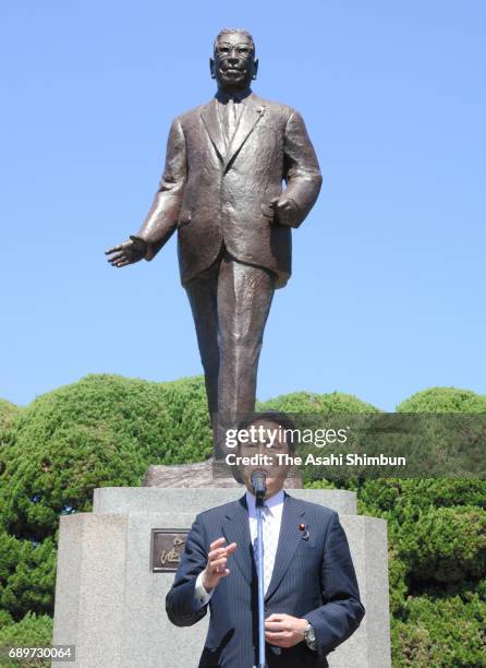 Foreign Minister Fumio Kishida speaks in front of the statue of Hayato Ikeda during the 60th anniversary of the foundation of the 'Kochikai', ruling...