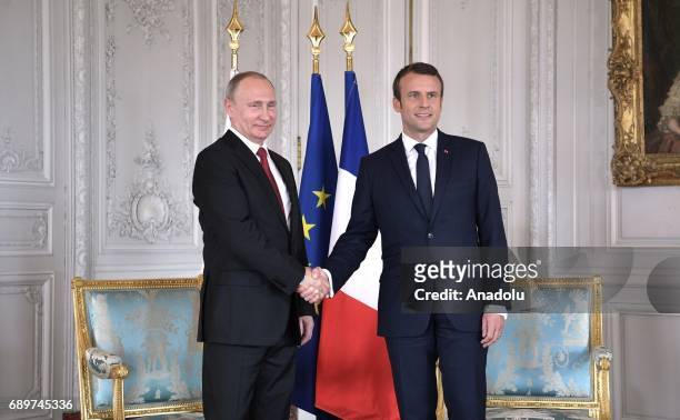 Russias President Vladimir Putin and France's President Emmanuel Macron meet at the Palace of Versailles in Paris, France on May 29, 2017.